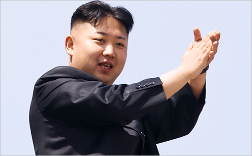 North Korean leader Kim Jong-Un (L) appl